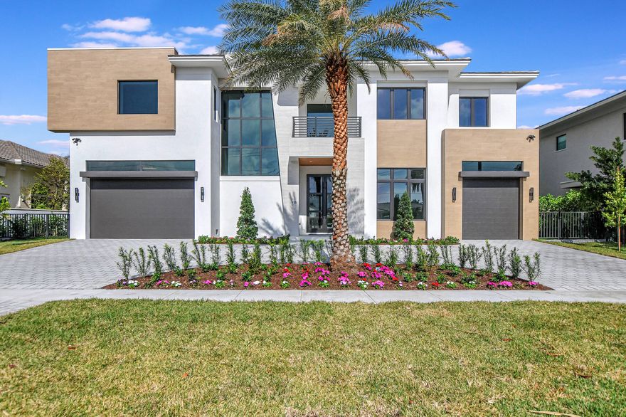 Bring Your Yacht and walk to the beach at this brand new No Fixed Bridge Lake Rogers Isle Deepwater estate. This Luxury New Construction home encompasses unparalleled features, expertly crafted by Elysee Homes, one of Boca Raton's premier custom builders. The residence boasts a resort-style pool deck, a concrete dock perfect for yacht enthusiasts, and full summer kitchen. Enjoy the ultimate comfort with his and her master suites, complemented by a full house generator, elevator, and a natural gas meter. The property's unique appeal extends to its large turn basin, providing convenient boat maneuvering.