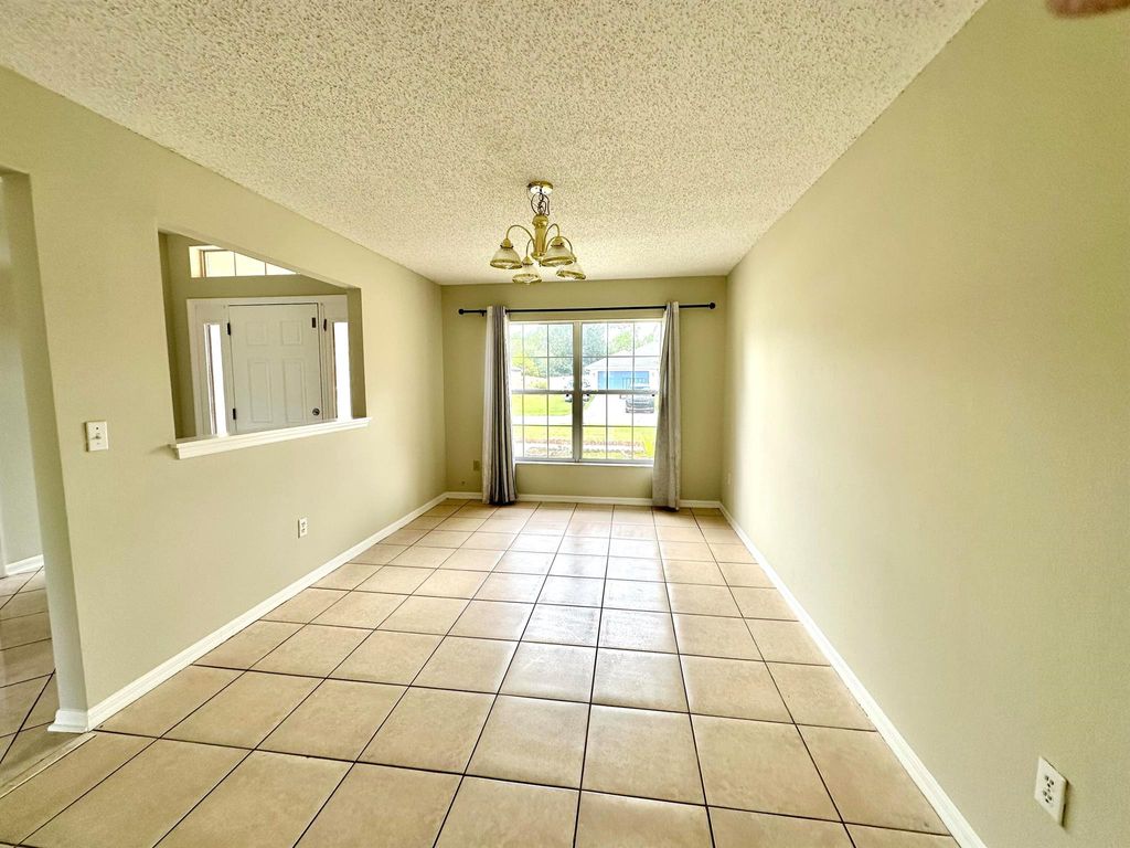 Photo of 1540 SW Birkey Avenue, Port Saint Lucie, FL 34953 (MLS # R11115371)
