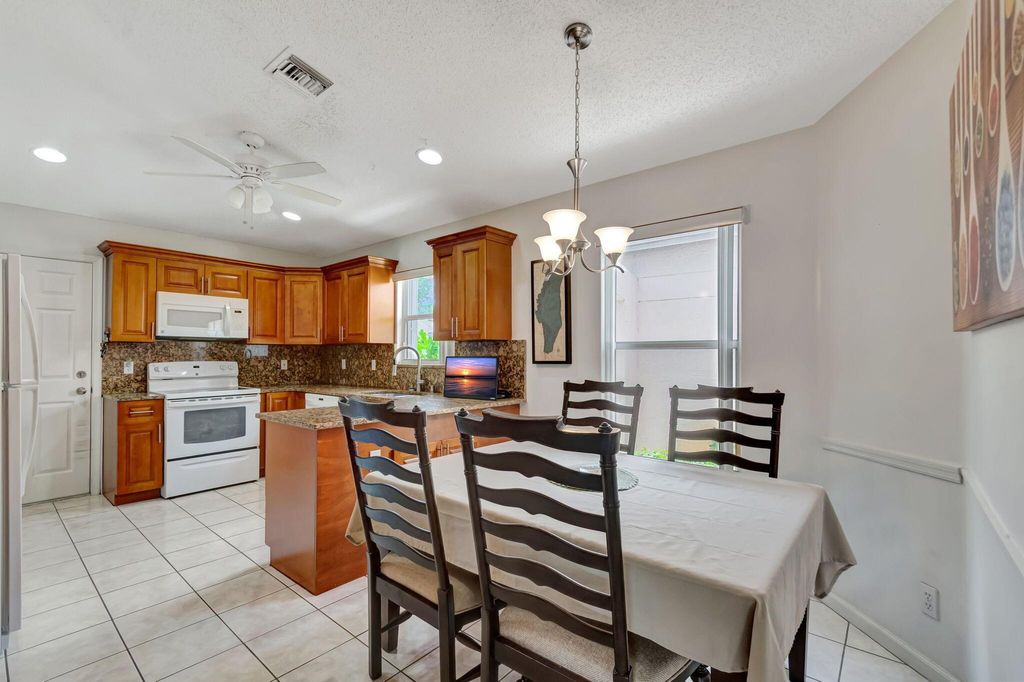 Photo of 1028 Island Manor Drive, Greenacres, FL 33413 (MLS # R11085475)