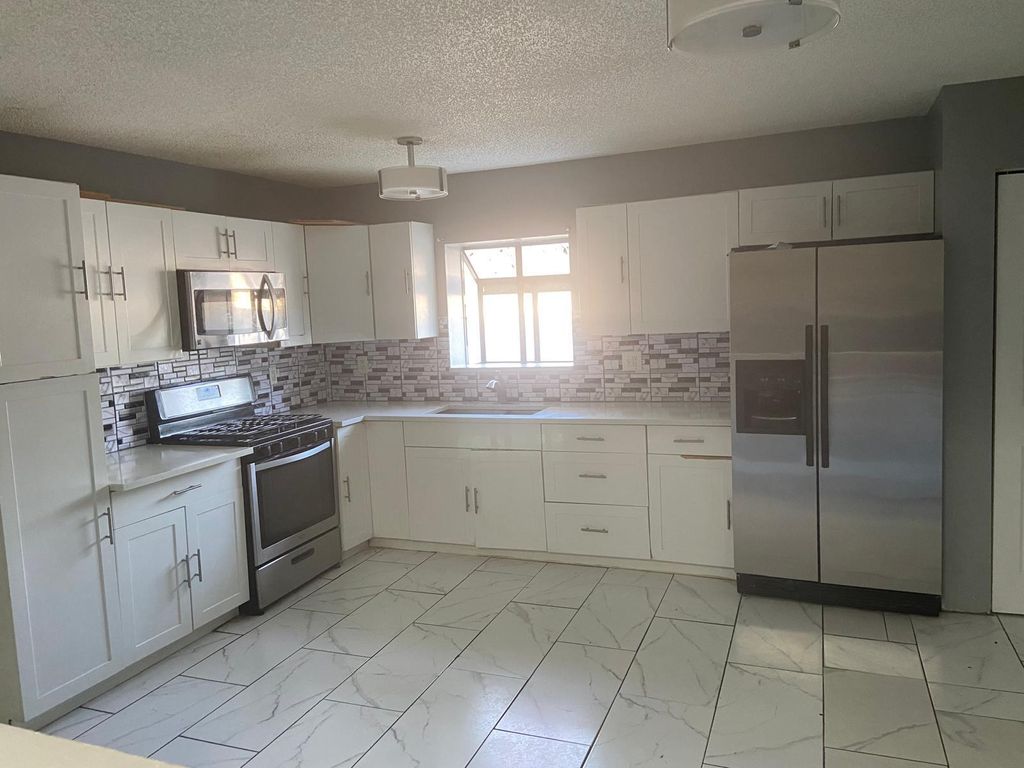 Photo of 5830 Lincoln Circle W, Lake Worth, FL 33463 (MLS # R11083856)