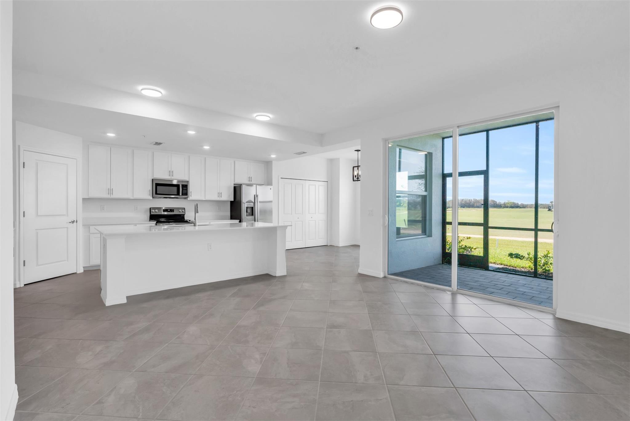 1680 SQ FT, LOWEST PRICE, BRAND NEW - Yearly rental in Ave Maria! This FIRST FLOOR condo overlooks the 2nd hole of The National Golf Club. Relax & take in the stunning sunsets from one of the 2 screened-in lanais, in front & back of the condo. This beautiful 2 Bed, 1 den & 2 bath unit is tiled throughout with a huge kitchen island to entertain, recessed lights & fans in all rooms. One of few units with 1 car garage. Cable, internet & water incl. Town Center is less than 6 minutes away with its small town feel yet packed with shopping, dining & community events. This guarded, gated, golf community is designed for those who crave luxury, activities and resort-style amenities incl tennis, pickleball, resort-style pool with a bar and grill, a fitness center & a spa. This unit won’t last.