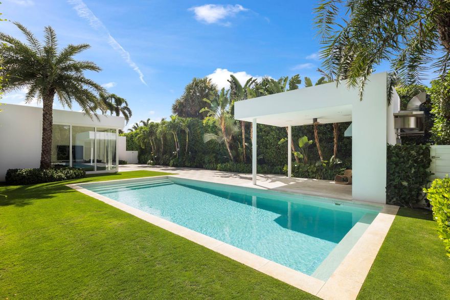 Welcome to Villa Blanca on the North End of Palm Beach Island. This modern marvel is a private oasis built to the highest quality. Starting with the custom front door designed by internationally acclaimed architect Isay Weinfeld, no detail has been overlooked in this custom built home. Boasting bespoke finishes including Peetz windows and doors from Germany and imported Italian travertine floors, the residence features level 5 finishes throughout and museum quality skylights also seen in The Whitney Museum in New York - which warmly welcome the immense natural light to flow into every room.