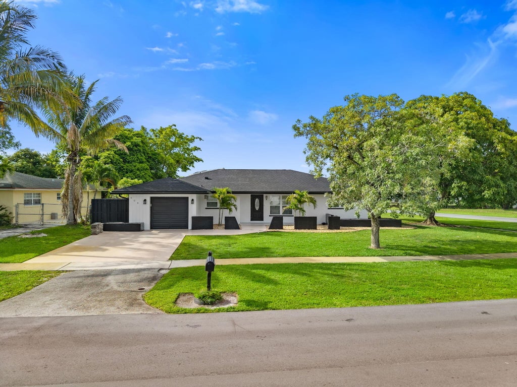 Photo of 908 Hibiscus Drive, Royal Palm Beach, FL 33411 (MLS # B26041827)