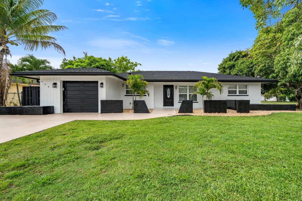 Photo of 908 Hibiscus Drive, Royal Palm Beach, FL 33411 (MLS # B26041827)