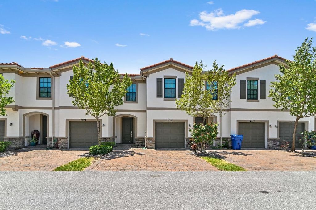 Photo of 2015 Tamarind Drive, Riviera Beach, FL 33410 (MLS # R10989989)