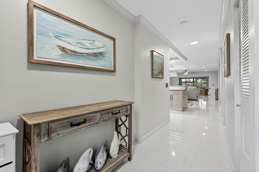 Welcome to the heart of Boca Raton!  This move-in ready home offers an open-concept layout that flows effortlessly from the moment you step inside to the spacious, impact glass enclosed patio. Beautifully landscaped grounds with view of the 9th hole on the golf course. Inside, you'll find luxury finishes throughout--porcelain flooring, high end quality appliances, crown molding.  Impeccable elegance and modern convenience come together in this meticulously maintained home. The location? Don't even get me started!  Exceptional. Just steps from popular shops and restaurants, the mall, walking distance to pools and only minutes from downtown and the ocean.   Beautiful Golf Course and No membership required!  Open to the public on Wednesdays.  Call me today and let's take a look!