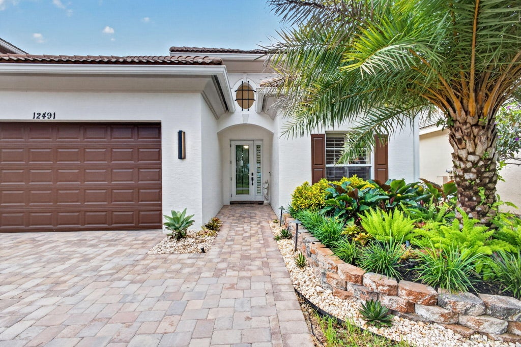 Photo of 12491 AVILES Circle, Palm Beach Gardens, FL 33418 (MLS # B26083393)