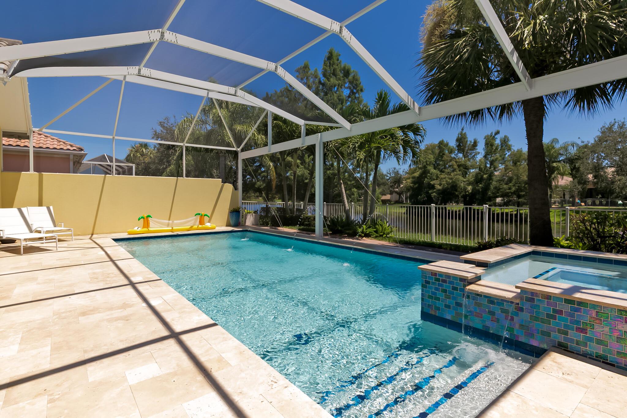 The owners have transformed this peaceful lakefront retreat into their own private paradise. With exceptional pride of ownership, they have thoughtfully remodeled the entire home & invested over $250,000 in upgrades. Truly unmatched in its size and price range, this contemporary residence is move-in ready and designed to impress. Included upgrade list describes the tremendous investment the sellers have lovingly added. Highlights: FULL HOUSE IMPACT GLASS WINDOWS & DOORS, RESORT STYLE HEATED POOL & SPA WITH TRAVERTINE TILE & PICTURE FRAME SCREEN, REMODELED KITCHEN, BATHS & LAUNDRY ROOM, POLISHED TILE FLOORS W/ NO GROUT LINES, AC 2020, HWH 2025, CUSTOM LANDSCAPING, PAVERS, FENCE & LIGHTING, triple crown molding, chair rails, shadow box trim, plantation shutters & LED recessed lighting.