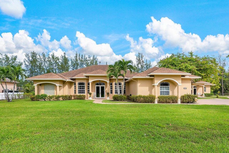 Discover the epitome of luxury living in this spacious CBS block home, a true entertainer's haven. The main house, boasting 4 bedrooms, 3 full baths, and 2 half baths, offers a harmonious blend of comfort and sophistication. Outside, indulge in your desire for entertainment with a heated saltwater pool, a grill and bar area, and a refreshing outdoor shower. Indoors, a cozy fireplace in the family room, a gourmet kitchen with granite countertops, and a seamless flow between the dining and formal living rooms create the perfect ambiance for both everyday living and hosting gatherings. Additionally, find flexibility in an extra room that can serve as an office or gym.
Feel secure with hurricane impact windows and doors throughout. The property offers convenience with an RV hookup, a two-car garage with epoxy flooring and a fully fenced-in yard spanning 1.29 acres equipped with multi-zone sprinklers. Completing this remarkable property is a 2-bedroom guest apartment, featuring a full kitchen, laundry, living room and 1.5 bathsan ideal retreat for potential rental income, guests or extended family. This residence is more than a home; it's a lifestyle. Embrace this serene setting and make this spacious property your home.