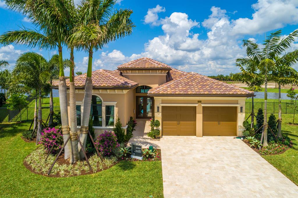 This model sits on an oversized cul-de-sac lot featuring the most breathtaking fountain lake views on the model row. This is a one story home featuring 3 bedrooms all en suite with walk-in closets and a den. There is an upgraded cabana bath with access to the covered patio. This is a great room floorplan with a formal dining room and open gourmet kitchen with 12 to 15 ft ceilings throughout. There is a beautiful upgraded summer kitchen in the covered patio overlooking a gorgeous lagoon style swimming pool with raised waterfall spa and planter with waterfall feature.