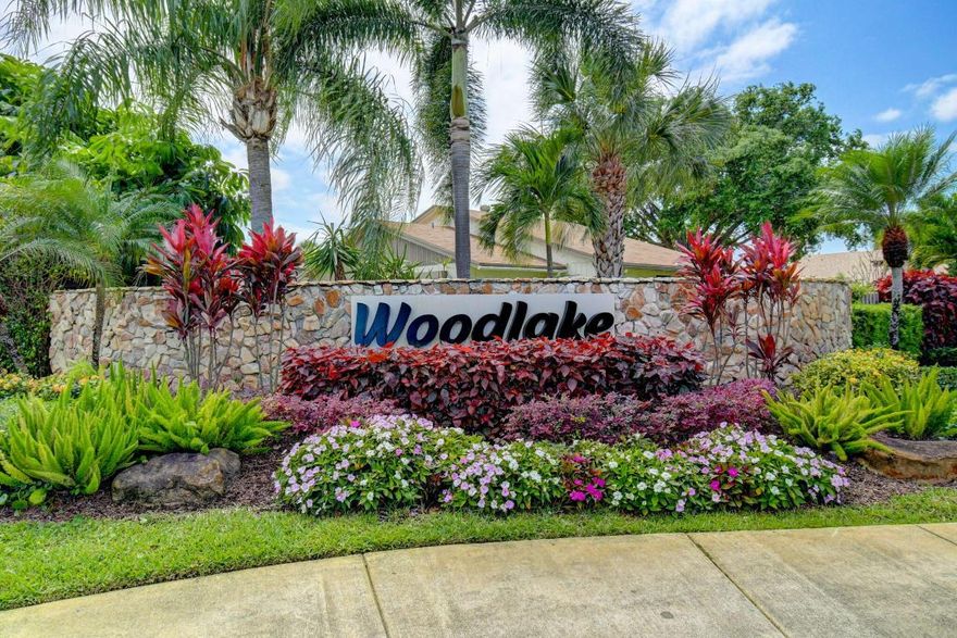 This bright Lake Villa features an extended great room with volume ceilings, seamlessly combining the living room with a fireplace heater, dining area, and open kitchen. Impact glass doors and windows surround the space, filling the home with natural light. A fenced, manicured backyard creates a perfect setting for pets to enjoy the home just as much as the owners.
A central atrium brings abundant light into the foyer, living area, and third bedroom, enhancing the home's open and airy feel.
Porcelain tile flooring runs throughout the villa. The bathrooms have been tastefully updated: large wall shower tiles to the ceiling, floating vanities, modern toilets, and dimmable light fixtures.
The open, luminous kitchen offers white cabinetry with pantry drawers, cabinets and storage on both sides of the large island, recessed lighting, a retractable plug-in on the island countertop, and a retractable range hood.
The primary bedroom includes a full wall closet, walk-in closet, and an updated en-suite bathroom.
Outdoor shower for rinsing off after the beach.
Located in the pet-friendly Woodlake community with low monthly maintenance fees. Amenities include a heated pool, fitness room, tennis and basketball courts, and on-site management.
Conveniently located near major highways, downtown Delray Beach, beaches, shopping, and local services.