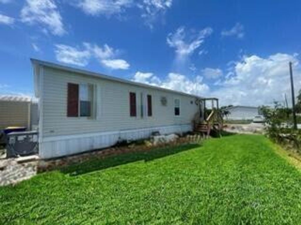 Photo of 8075 SE Wren Avenue, Hobe Sound, FL 33455 (MLS # R11011458)