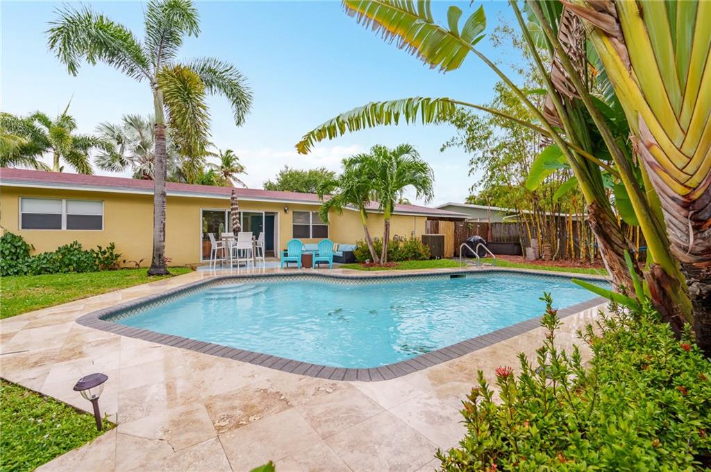 A long list of impressive features adorn this very well priced Wilton Manors Westside Ranch! Three BR split with 2 full updated baths and a heated pool. Bright, spacious open living, dining, kitchen area complete with huge marble top center island, bar seating, wood cabinets and newer appliances. Marble and wood flooring, crown moldings, abundant recessed lighting, nicely updated baths and interior laundry. A private fenced back yard oasis with mature landscaping and a very specially designed heated pool. Ample room for entertaining, BBQs, parties and private time. Impressive curb appeal with circular paver driveway, carport and tasteful landscaping. Move in ready or operate as a successful vacation rental. A/C, roof, electric panels & appliances new in 2019/2020.
great for entertaining