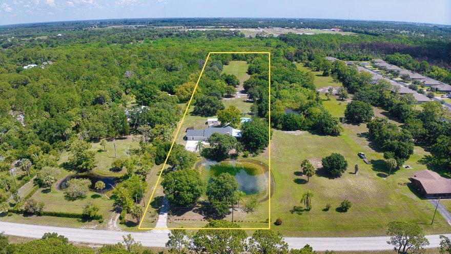 Serene 4-bedroom, 3-bathroom modern farmhouse set on 5 acres with beautiful landscaping and peaceful pond views. Features a brand-new roof, new culvert, impact windows, gutters and water heater. Cozy family room with a charming wood-burning fireplace. Newly renovated kitchen with custom cabinets, quartz countertops, and breakfast nook. Primary suite offers a large shower and walk-in closet. Relax by the pool with farm views or unwind in the Florida room. 2 wells. No HOA, paved road, and conveniently located close to all Vero Beach's amenities.