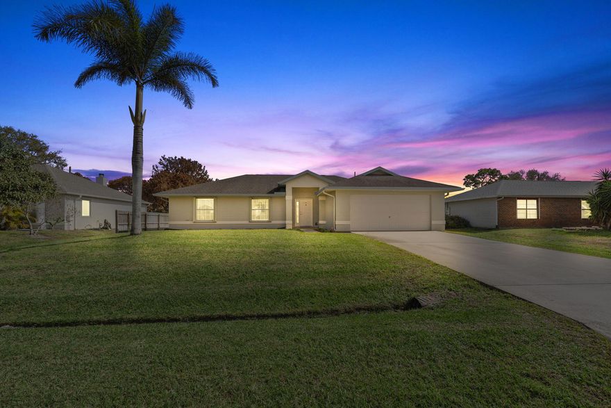 First time ever offered on the resale market, this well maintained home offers a thoughtful layout and solid construction built in 1999 by All American Homes, featuring the Jackson floor plan. Constructed of concrete block, the home offers 3 bedrooms and 2 bathrooms with a spacious design enhanced by cathedral ceilings that create an open, airy feel the moment you walk in. The living areas feature beautiful tile flooring, while the main suite and one guest bedroom offer carpet for added comfort. The primary suite includes a relaxing soaker tub, creating a comfortable retreat at the end of the day. Major updates provide peace of mind, including a roof replaced in 2018, accordion shutters installed around the entire home in 2019, a new A/C system in 2021, and a water heater installed in 2026 The exterior has also been freshly painted, and the property includes an irrigation system on well to help maintain the yard efficiently. Step outside to enjoy the screened in lanai overlooking a fenced backyard, open on one side, with a storage shed. The oversized 10,785 sq ft lot offers plenty of room for outdoor living, gardening, pets, or future possibilities. Located in a quiet neighborhood with convenient access to everything the area has to offer. Approximately 5 minutes to the Florida Turnpike, 10 minutes to I-95, 15 minutes to Tradition Village Center, and about 30 minutes to the beach. Homes that have been this well cared for and offered for sale for the first time don't come along often.