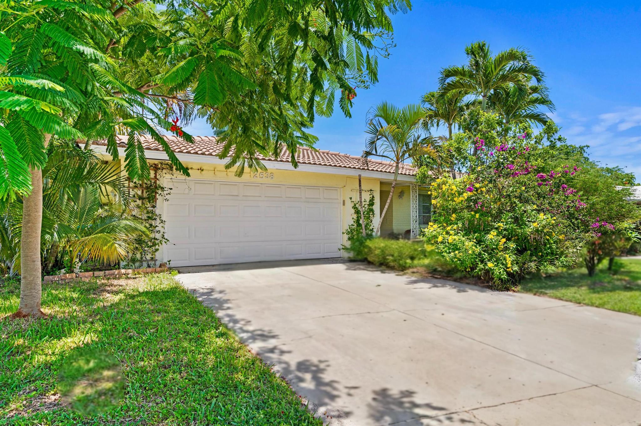 Welcome to Golfview Harbour, where you can live life your way! This CBS-constructed, 3-bedroom, 2-bath, 2-car garage home offers over 2,000 square feet of split-bedroom living space with absolutely NO HOA rules or fees. That's right you can park your boat, RV, or your grandma's prized lawn gnome collection without any hassle. There's plenty of room to roam not just inside, but outside as well with a lush, tropical backyard that provides the perfect private escape for relaxing or entertaining.When you're ready to venture out, you're just a quick trip from Boynton's white sandy beaches, I-95, and a plethora of shopping and dining options. This home is priced to sell, making it the perfect opportunity for the savvy buyer who knows that