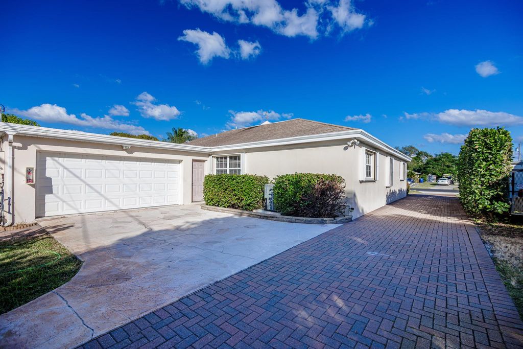 Photo of 527 W Jasmine Drive, Lake Park, FL 33403 (MLS # R11141609)