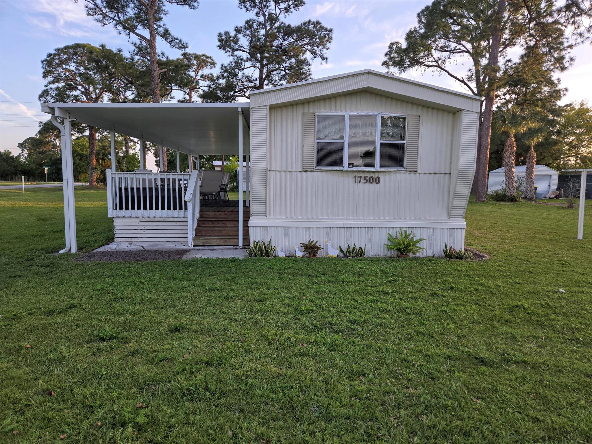 KISSIMMEE RIVER ESTATES - This charming 2 bdrm 1 ba mobile home is situated on 3 lots and offers 730 living sq. ft. Covered front porch and carport. Indoor utility. Enjoy the serenity of this quiet community. Located just minutes from the Kissimmee River. Mobile home is fully furnished, ready to move in and maintained nicely. Kitchen features large windows to allow tons of natural lighting. 3rd lot has a septic tank. Riding Lawn Mower conveys with property. Room sizes are approximate - must measure for accuracy. Don't miss out on this perfect seasonal residence!