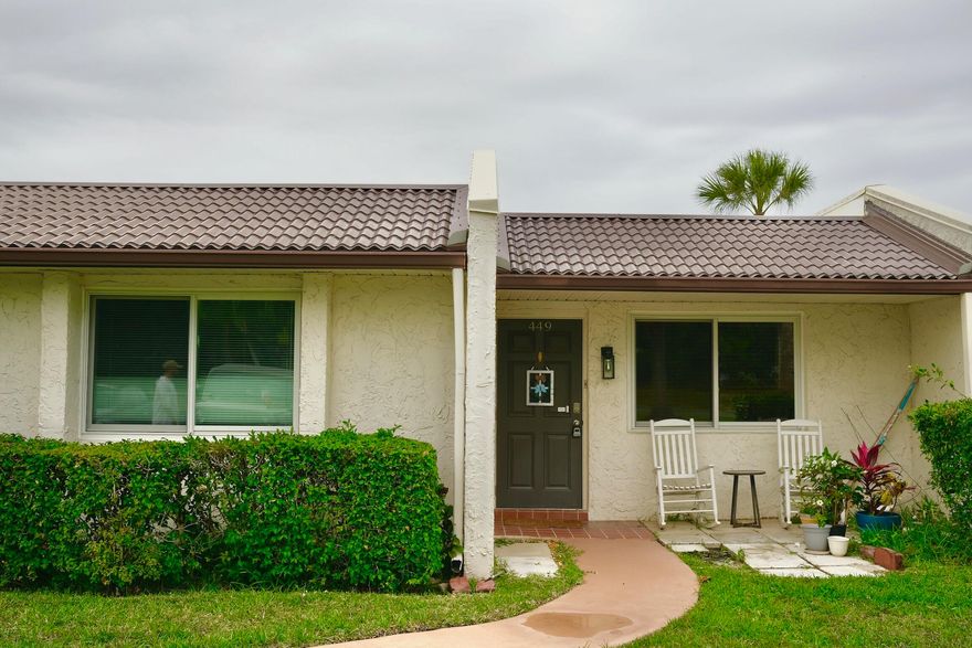Largest model in Golden Lakes 55+ community! This spacious E-Villa features a formal dining area, tile and wood flooring throughout, and a well-maintained kitchen with appliances replaced in mid-2022, including the refrigerator, range, dishwasher, and microwave. A new hot water heater and fairly new A/C provide added comfort and peace of mind.  Enjoy the oversized enclosed patio with a stunning lake view, plus an additional storage closet for added convenience.  Residents of Golden Lakes enjoy an exceptional lifestyle with HOA maintenance that includes cable, internet, building insurance, water, sewer, guard-gated security, recreation facilities, tennis, and a full-time social director. A courtesy bus is available twice a week for trips to grocery stores, shopping centers, and malls. Attention All Brokers: This property is located in an ideal location to stores, restaurants and services. It is also less than a mile from Florida's Turnpike. A Courtesy bus is provided twice a week for residents' shopping needs. Capital contributions of $3,240 paid by Buyer at closing. The HOA has 100% in ''Reserve Funds. Total of 800 units. Application fee $100 for first adult couple., an additional $100 for additional adult. Interviews scheduled for the 1st and 3rd Thursday of each month. A 20% minimum down payment required if financed. Buyer cannot rent unit in the first year of ownership.