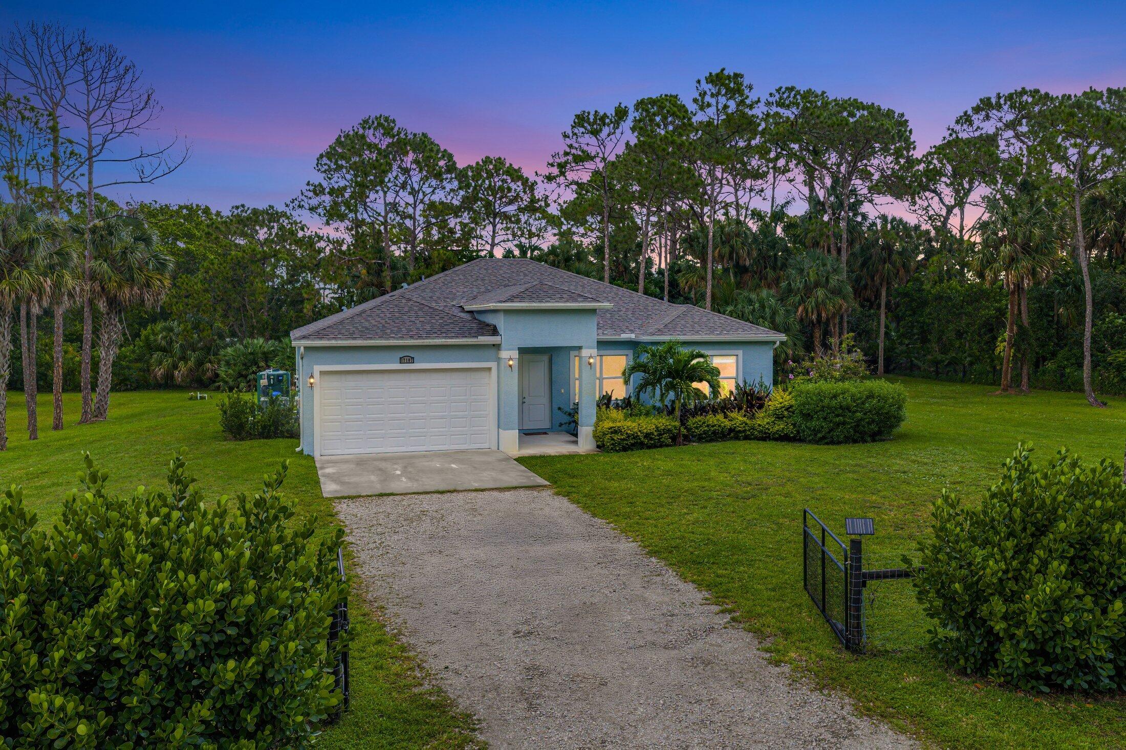 WELCOME HOME This well appointed 2022 built gem is resting on a premium 1.15 acre lot and boasting 4 true bedrooms, 2 full baths, 2 car garage, upgrades galore, hurricane impact windows and doors throughout and this beauty is in a peaceful location! ENTERING you will discover that this home is on a high and dry lot with no pond and fully fenced. The covered entry brings you inside where you are greeted by 10' volume ceilings, high-end flat wall finish, porcelain and luxury vinyl flooring, abundance of natural lighting and gorgeous kitchen that features; a stainless steel appliance package, quartz counter tops, lovely backsplash, spacious island with bar, shaker style cabinetry with two pantries, breakfast nook and great room that overlooks the expansive green space. (CLICK)