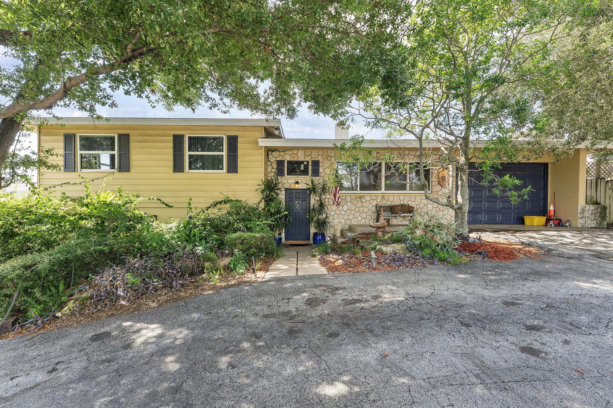 Have you ever imagined living in a home with its very own underground bunker? This extraordinary property offers the ideal opportunity you've been searching for! Located just a few blocks from Bethesda Hospital, less than 2 miles from the beach, and less than 3 miles from downtown Delray, it truly has it all.This spacious and unique home features a brand new roof and sturdy impact windows. Inside, you'll be welcomed by a charming brick fireplace that adds warmth and character to the living space. The main house includes 3 well-appointed bedrooms and 2 modern bathrooms, providing ample comfort and convenience.Additionally, the property has a separate in-law suite, complete with 1- bedroom and 1 full bathroom--perfect for guests or as an income unit, also includes Whole House Generator