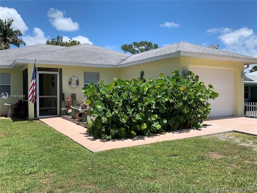 Photo of 1057 SW Spruce Street, Palm City, FL 34990 (MLS # R10713978)