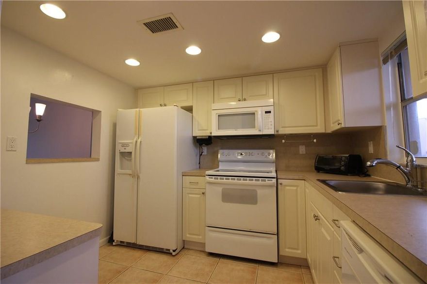 Bright & Spacious 1 Bed/1.5Bath on the First Floor with Lake Views. Updated Eat In Kitchen, Tile through out,  Lots of Closet space, with Huge Walk In Closet in the Master Bedroom. This Senior Community has Many amenities, Indoor and Outdoor Pools, Tennis, Socials Clubs, Billiards Room, Exercise Room, Entertainment Shows and Local Trips. Shuttle Drop off locations to Publix, Walmart, many other drop off points. Near Main Clubhouse for Phase 3 & Close to one of the few outdoor community Pools.A Must See.