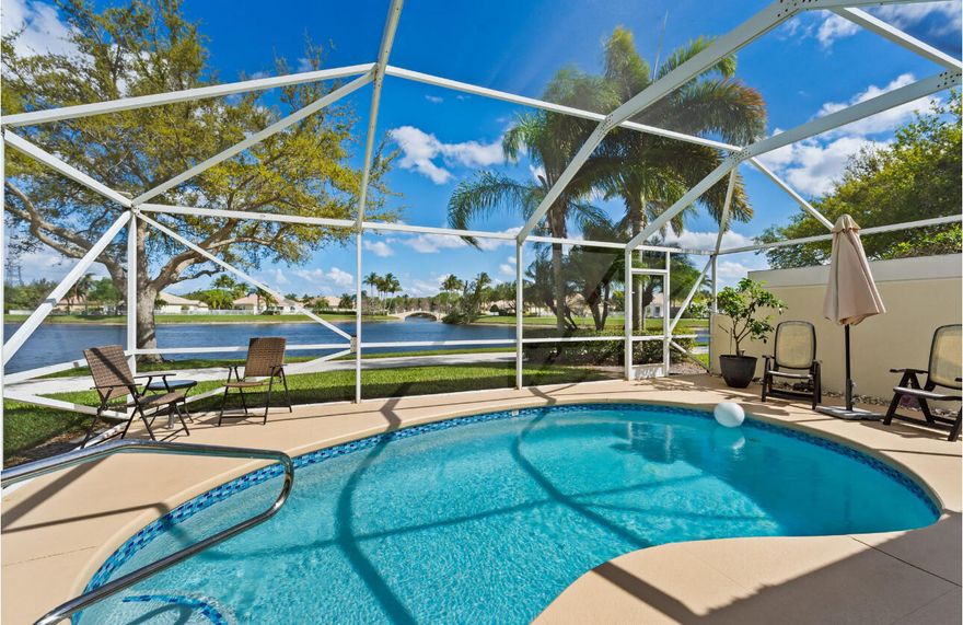 Looking for your own slice of paradise?Well, look no further!Enjoy panoramic lake views, picturesque Venetian-style bridges & stunning skies right from your home!This beautifully maintained 2/2 Capri model in VillageWalk offers an exceptional opportunity for you!  Tucked away at the end of a quiet cul-de-sac, this townhome sits on one of the community's most desirable wide lots w/ a beautiful side yard.Whether you're unwinding on the semi-enclosed lanai or taking a dip in your private screened-in pool,  you'll experience breathtaking sunrises, serene water activities like paddleboarding & kayaking & unforgettable moonlit reflections on the water.Special features incl. a spacious open floorpan, plantation shutters, extra closet space, impact windows/accordion shutters & a resurfaced pool.  VillageWalk Wellington offers a true resort-style lifestyle, featuring two heated pools, a state-of-the-art 24-hour fitness center, and courts for tennis, pickleball, basketball, and bocce. There's also a playground for children and a scenic 4-mile path perfect for biking or golf cart rides throughout the community's 954 homes.  Residents enjoy reasonable HOA fees that include a 24-hour guard-gated entrance, beautifully maintained landscaping, and a vibrant town center hosting a variety of social activities. Exciting additions are on the way, including an on-site family restaurant, hair salon, pet grooming services, and a private real estate office.