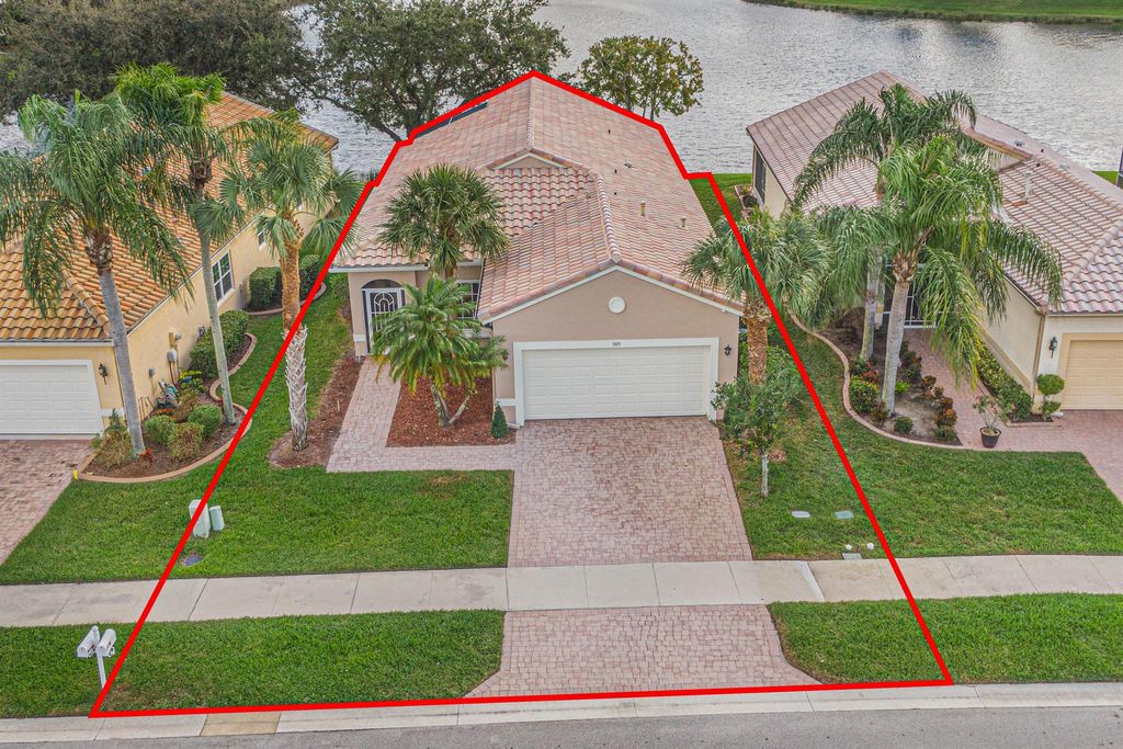 Photo of 309 NW Alana Avenue, Port Saint Lucie, FL 34986 (MLS # R10939853)