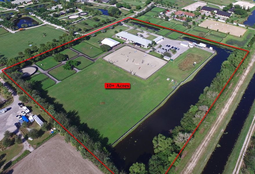 Nestled within Palm Beach Point East and a short hack away from PBIEC, this incredible 10-acre farm is fit for any professional rider. The 12-stall center-aisle stable, complete with the finest amenities, recently underwent a full renovation, leaving it totally updated and ready for the new season. The property features a new tack room with granite countertops and excellent storage, as well as a spacious owner’s lounge with a full kitchen and 2.5 bathrooms. Ample space for riding is available, courtesy of a large grand prix field and a new ring with top-grade fiber footing and an underground drainage and water system. The tent pad holds 15 12x12 stalls, 9 paddocks, a large lunging ring, and covered treadmill and blacksmith areas. Bring your horses home to this spectacular farm this season.