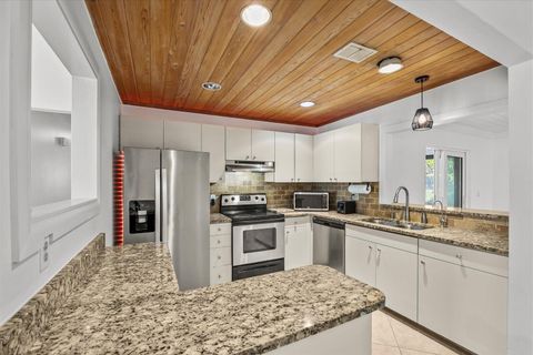 Photo of 1250 SE Petunia Avenue, Port Saint Lucie, FL 34952 (MLS # B26001757)