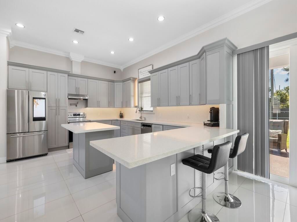 Photo of 914 SW Mccracken Avenue, Port Saint Lucie, FL 34953 (MLS # B26003143)