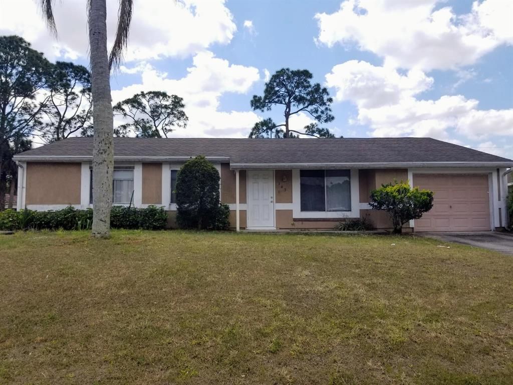 Photo of 143 SW Tulip Boulevard Blvd, Port St Lucie, FL 34953 (MLS # R10708503)