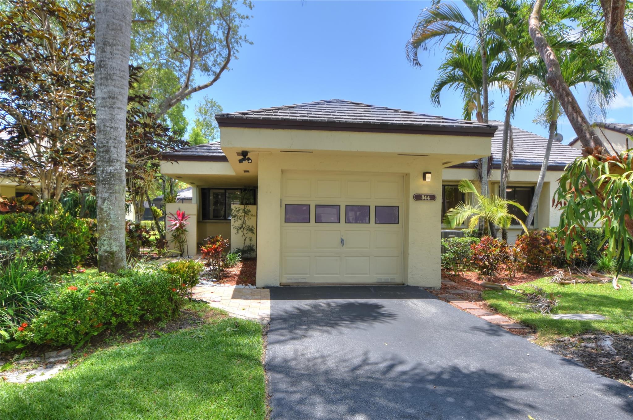 Prestigious Central Park @ Jacaranda is surrounded by lush landscaping, winding roads and various waterways which give the community a feel of being in a park. This highly desirable corner, Carlyle model has kitchen with separate breakfast nook; ample cabinet and counter-top space; food pantry; and entertainers pass-thru to the dining room. Vaulted ceilings in the living room give it a spacious feel and all bedrooms are a generous size. Both bathrooms are updated and the master shower has a lovely tiled shower with glass enclosure. Air conditioning system replaced in 2021; roof replaced in 2019; and best of all - the entire plumbing system was upgraded in 2024. There are accordion shutters for hurricane protection and a large community pool with spa - all in a fabulous location!