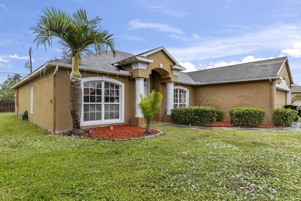 Photo of 4218 SW Utterback Street, Port Saint Lucie, FL 34953 (MLS # R10931345)