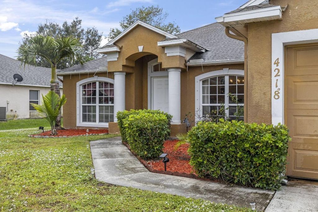 Photo of 4218 SW Utterback Street, Port Saint Lucie, FL 34953 (MLS # R10931345)