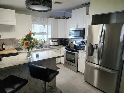 Photo of 4748 SE Balsawood Terrace, Stuart, FL 34997 (MLS # B26077646)