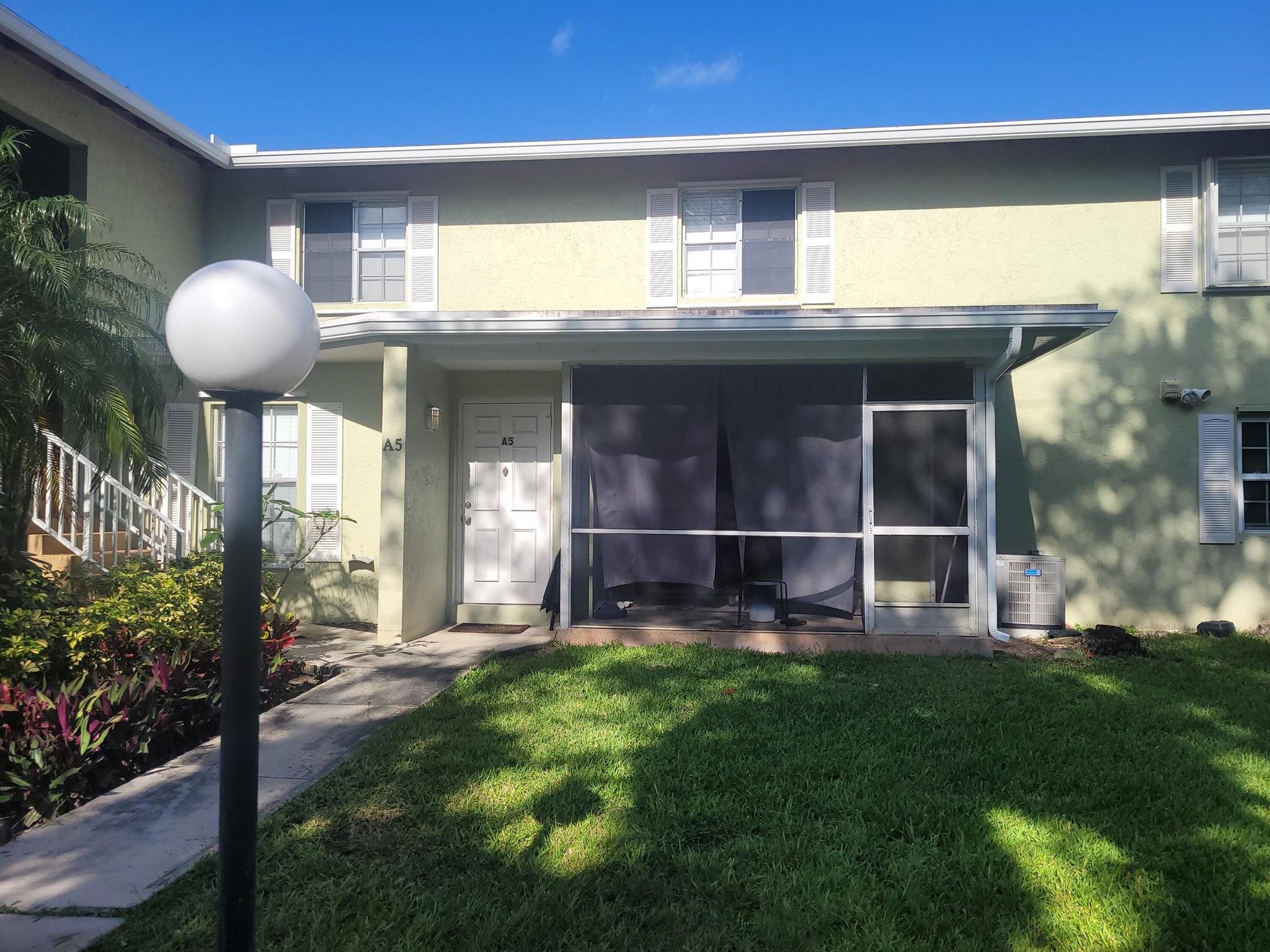 This two-story townhome-like condo features tile in the downstairs living spaces, updated kitchen/bathrooms, stainless steel kitchen appliances, private covered and screened patio, just a few steps from the pool area. Storm protection for all windows. Laundry center on the first floor, next to the kitchen.Your monthly maintenance fee includes water, the common areas/pool, and exterior insurance.Located just minutes from the Gardens Mall, Downtown at the Gardens, and Legacy Place. Close to fabulous shopping options, public beaches and parks, nearby restaurants, craft breweries, PBC community college, grocery stores, golf courses, boating, watersports, and numerous entertainment choices.