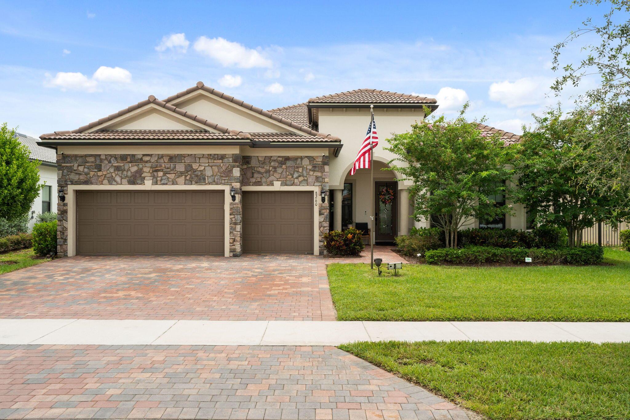 Come experience ''THE PINNACLE'' Estate Series - at the highly desireable Community of THE FIELDS. Enter the huge Open Floor Plan GATHERING ROOM with soaring COFFERED CEILINGS. The COVERED LANAI has a DISAPPEARING WINDOW-WALL enhancing the view further by raising the Phantom Screen. The CHEF'S KITCHEN shares a HUGE ISLAND BAR perfect for entertaining guest . The BONUS ROOM serves as a Professional Office Suite. Additonal upgrades: CUSTOM CLOSET TREATMENTS, GARAGE SUSPENDED STORAGE SPACE, more... This ENERGY EFFICIENT HOME utilizes SOLAR PANELS (10.73 KW) and a 13.3 KWh Battery (will keep lights on, refregeration and more indefinitely in a power outage). Even with an EV CHARGING STATION in garage, the July 2025 FPL Bill was only $118.08. Yes, Room for a Pool possible​​‌​​​​‌​‌​​​‌‌​​​‌‌‌​​‌​​‌‌​​​​ too.