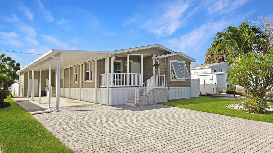 Perfect Beach Town Getaway. Upgraded 2017 Jacobson MANUFACTURED home w/1,550 SF of beautifully designed space along w/amazing exterior features. Granite & stainless appliance kitchen w/island, crown molding, seamless drywall, & custom closets.  2016 spa, 2021 infrared sauna, & large screened patio in a fully fenced backyard (6ft wht pvc privacy). 28ftx15ft screened patio w/electric, ceiling fan, & attached Elite Roof for plenty of shade. Built for comfort and durability with impact sliders/doors, hurricane shutters, ¾'' plywood subfloor upgrade, storage & 2020 paver driveway. 48' Carport fits 2-3 vehicles. No HOA. Minutes to beaches, boat ramps, and all that Hobe Sound has to offer. Make this your beach getaway or become a first time homebuyer with this property that has it all!