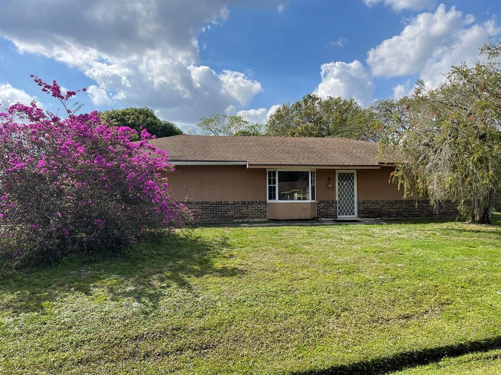 Photo of 702 NE Lanfair Street, Port St Lucie, FL 34983 (MLS # R10888612)