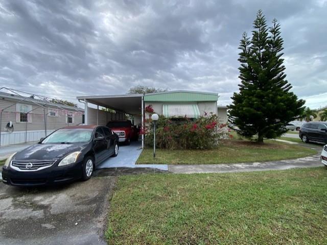 1014 square ft. on a oversized corner lot.
Both bedroom floors and kitchen floor have been replaced. Air conditioner replaced 2018. Awning canopy canvas aluminum roof replaced 2006.
Home has great potential.
Community offers 2 pools, recreation building with exercise room. Walking distance to high school.