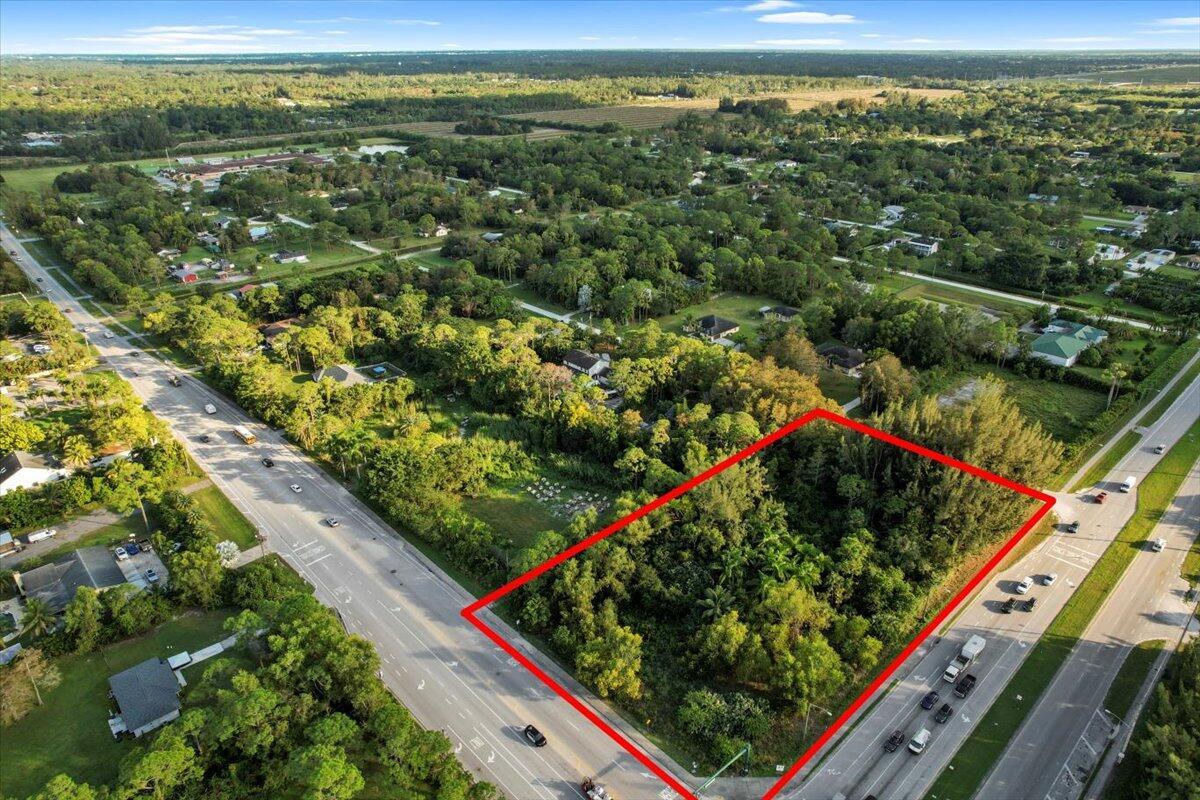 Presenting a unique investment opportunity: two adjoining parcels in Palm Beach County, each with its own parcel control number and individual listing. The seller prefers to sell both properties together, offering over 2 acres of prime land in a highly desirable area experiencing rapid growth and redevelopment.Parcel 1: A .98-acre corner lot located at Okeechobee Blvd and Seminole Pratt Whitney Road, offering high visibility and accessibility.Parcel 2: A 1.12-acre lot with additional frontage along Seminole Pratt Whitney Road, enhancing its development potential.Currently zoned Agricultural Residential, these parcels present immense potential for visionary development in a thriving location.