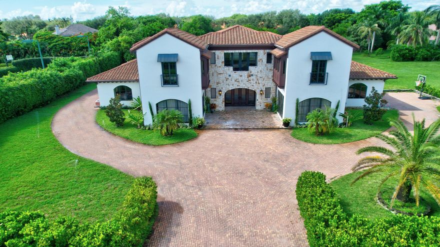 Built in 2020 in Boniello Acres!  Expansive estate has OVER 2 ACRES  to relax & enjoy the pool and spa.  Begin and end each day looking out over your PRIVATE LAKE while enjoying the peaceful sound of the fountain. This unique trophy estate brings the best of countryside living to central Boca. With a separate 2/2 IN-LAW /NANNY SUITE that includes a full kitchen and spacious family room, your guests, family, or friends can get every ounce of privacy they desire. Store all your toys in the 6-CAR GARAGE!  This property is a CAR COLLECTORS DREAM.  Garage ceiling is high enough to include a lift!  Room for tennis, pickleball or multi-sport court  available on the property. Boat and trailers shall be permitted. Up to 2 horses can be kept on the property. See suppl for more info 17905 Boniello Drive

Details:

Kitchen
All Thermador appliances 
Island includes sink and Edgestar wire cooler
Quartz counter tops
Pot filler
6 burner stove(propane gas) plus grill(electric)
Panel Refrigerator
Pull outs
Soft close drawers
Upper cabinets
Hard wood floors

Dining Room

Marble floor
Crown molding

Foyer

Double door entry
3 storage areas hidden under stairs

Miscellaneous

5 AC's-4 units and 3 mini splits
Elevator
Central Vacuum
2 Water heaters
Wood flooring throughout all bedrooms
Septic on side of house
Sprinkler system from lake
Icynene Foam insulation 3" on exterior walls and 6" on ceilings
Built in 2020
Room for sports court(tennis, pickleball, basketball, etc)

Great Room

30 ft ceilings
10 ft Mahogany doors
Marble floors
Custom Wall décor in great room
Built in fireplace
86" TV remains

Primary Bedroom and bath
Double drown molding and tray ceiling
Enormous custom closet
Marble floors
Dual vanities
Frameless shower w/ rain forest head
Separate tub

Downstairs Bedroom #1

Custom built in closet 
On suite bath with frameless shower

Downstairs Bedroom #2

View of pool/patio
Custom built in closet 


Upstairs Guest Bedroom #1

Large suite w/ sitting area and on suite bath wi/frameless shower.  
Marble on shower walls and travertine on shower floor.

Upstairs Guest bedroom #2

Spacious suite with on suite bath, walk in closet, frameless shower.


In-law/Nanny Suite

2 full bedrooms 
2 on suite baths
Kitchen-Samsung appliances, marble floors, living room, separate washer/dryer and linen closet.
Access to pool/patio

Garages and Driveway-Car collector dream!

2 car garage on 1 side of property with exterior storage closet 
3 car garage on opposite side of property has glass doors which provide view of lake
High ceilings afford room for lifts which can double garage capacity
Double circular driveway can accomodate 15+ cars
All garage floors are finished

Pool/Patio

Patio built with concrete and turf for a designer affect
Summer kitchen-propane gas
Pool/Spa are heated
View of lake and fountain
Garden Pergola with Chicago Brick Pavers

Laundry Room

Upper/lower cabinets
Electrolux washer/dryer
Pet Shower
Huge walk in pantry

Low HOA fee of $135/m
Boats and trailers permitted
Up to 2 horses permitted

Live your dream!