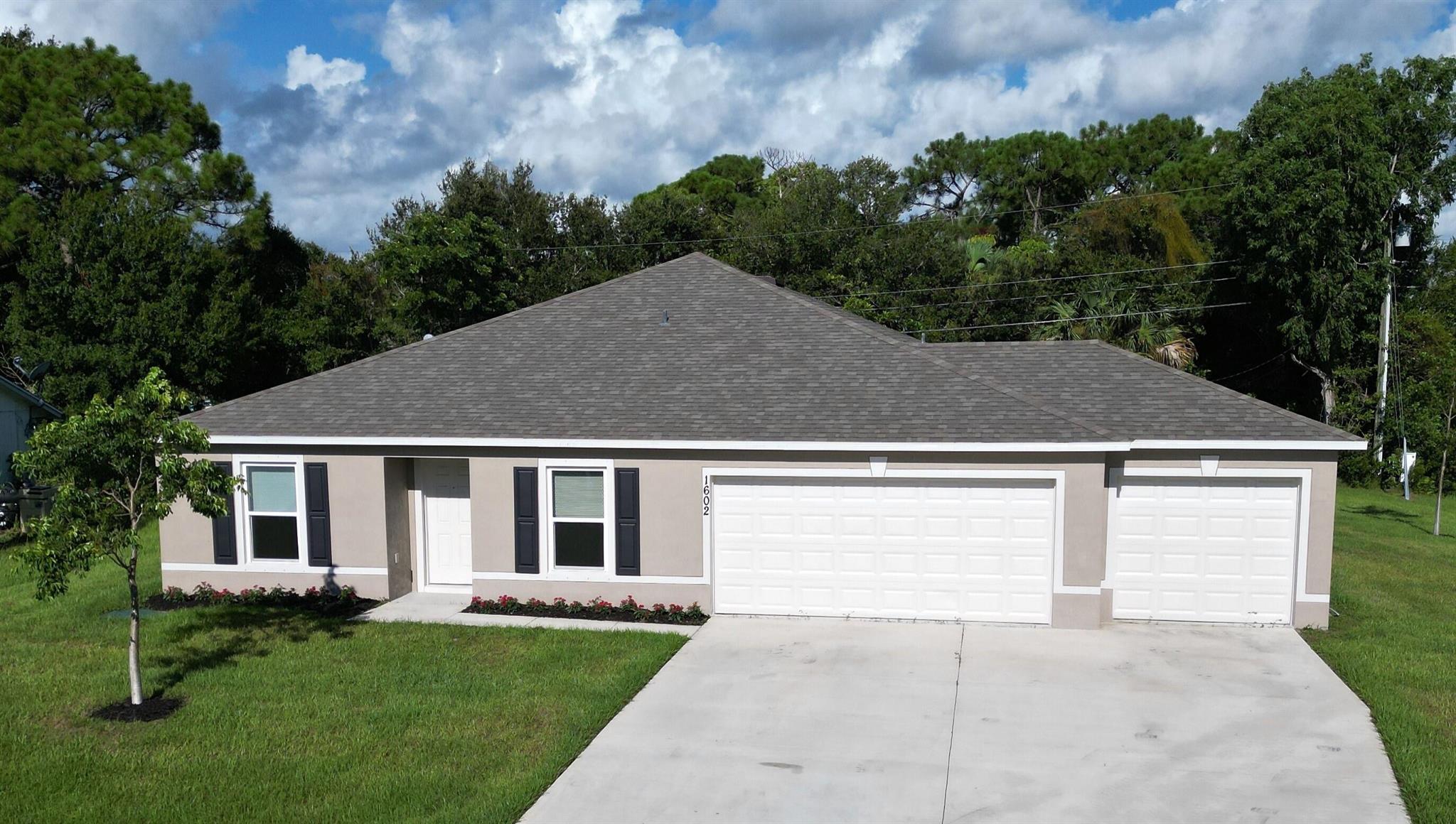 Charming 4 Bedroom, 2 Baths, 3 Car Garage, built in 2023, situated on an Oversized Corner Homesite in Port St Lucie! Discover Beautiful 1602 SE Mansfield Street! Built with sturdy CBS construction, this home features 1,806 sq ft of spacious living space overlooking your oversized open corner lot. Plenty of room for a tropical pool and all your toys, insulated windows. Enjoy a prime location close to hospitals, schools, and shopping. Perfect for any family! Don't miss out--schedule your viewing today!