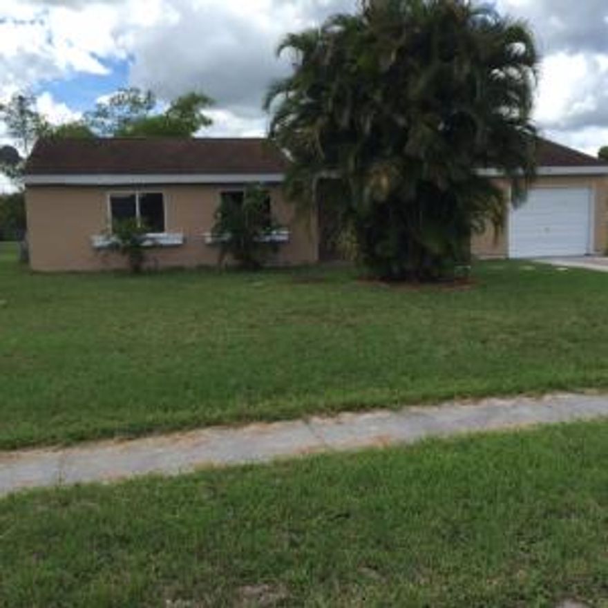 RECENT UPDATE WITH NEW KITCHEN.NEW TILE  FLOOR .FRESH PAINT AND MUCH MORE!FENCED YARD AND GREAT NEIGHBORHOOD.