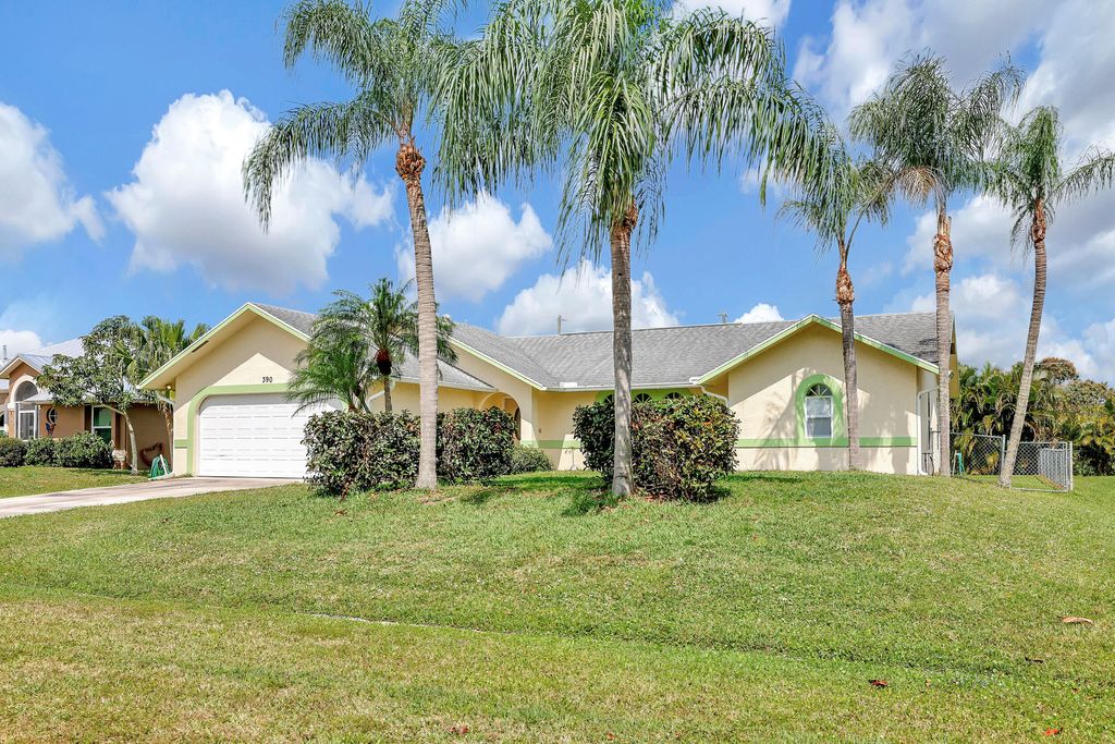 Photo of 390 SE Cork Road, Port Saint Lucie, FL 34984 (MLS # R10967129)