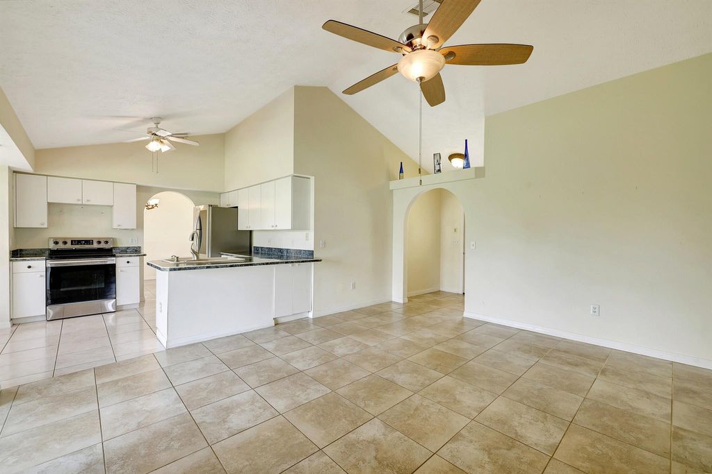 Photo of 390 SE Cork Road, Port Saint Lucie, FL 34984 (MLS # R10967129)