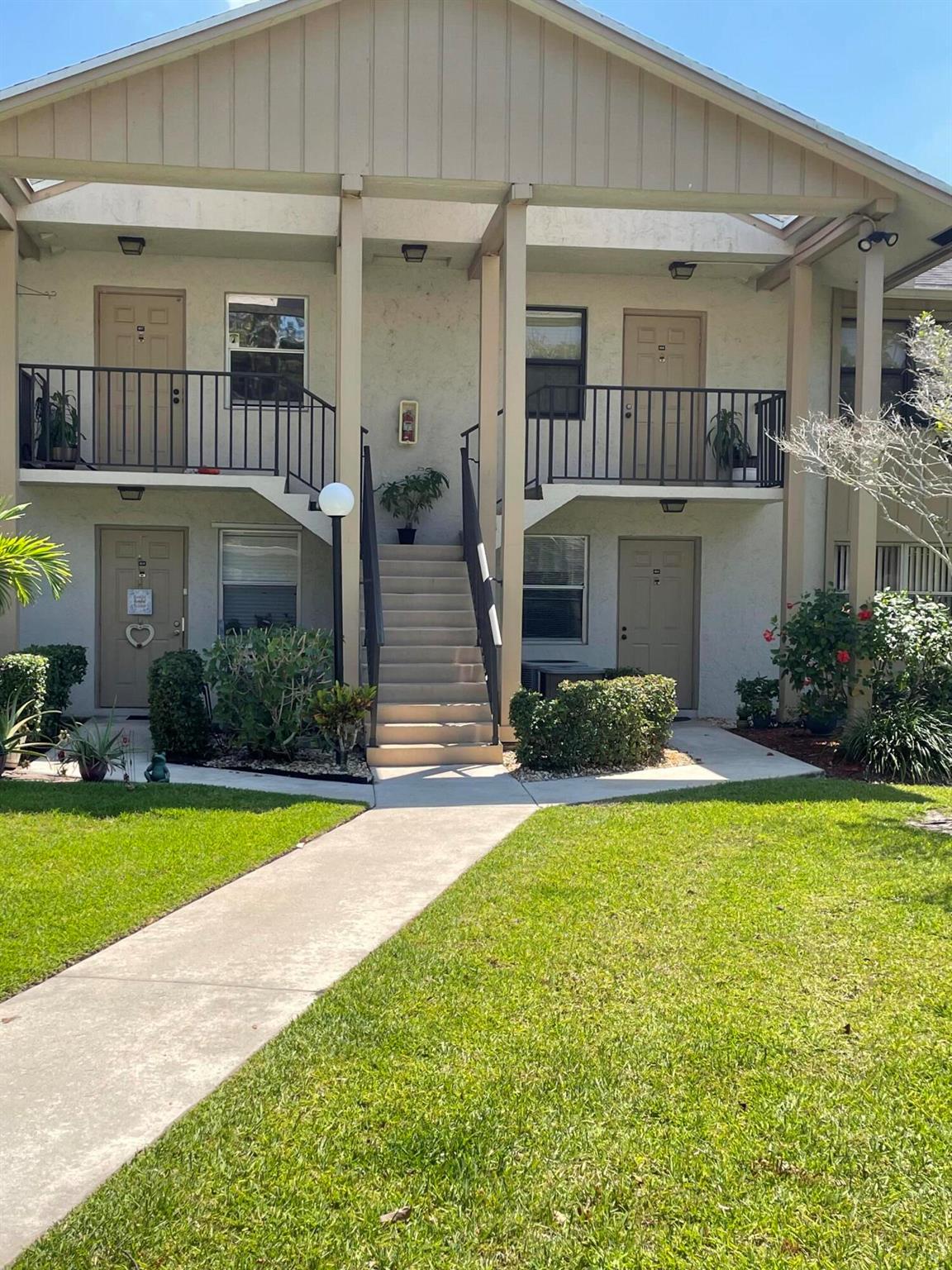 Gorgeous describes this totally updated 2 bed 2 bath corner unit, located in Indian Pines. Beautiful views of the lake and nature. Brand new bathrooms, new laminate flooring, beautiful granite tops, and newer appliances, including washer and dryer! One carport parking spot. Screened in balcony with serene views. Impact windows. This unit is located in the back of the community offering privacy. Indian Pines has redone the tennis courts and repaved the roads. Close to everything Stuart has to offer and just minutes from the brand new Costco! No Smoking. No pets