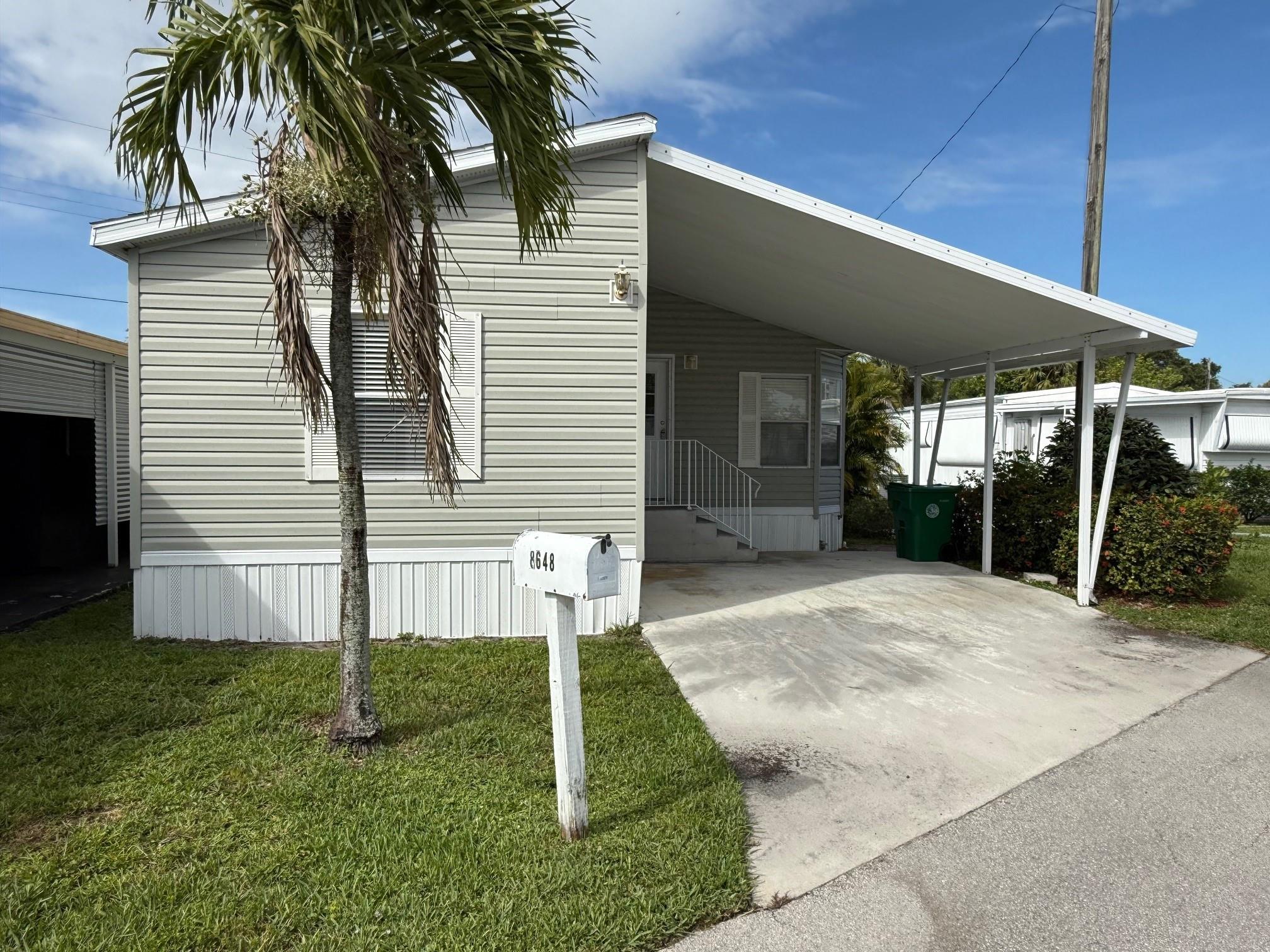 2006 Double with carport, just painted and all new flooring. This home is steps from one of three clubhouses.